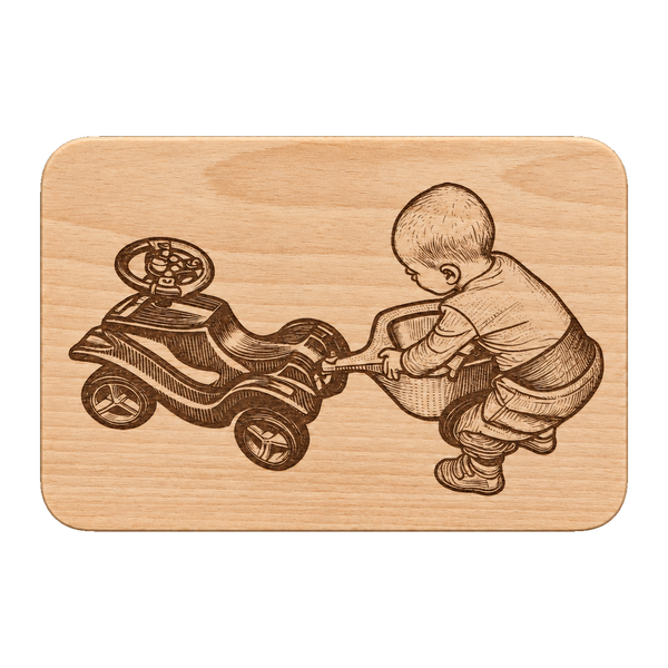 Baby mit Bobbycar auf Holzbrett